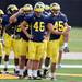 Michigan freshman place kicker Matt Wile leads a line during warm ups at practice on Tuesday.  Melanie Maxwell I AnnArbor.com
